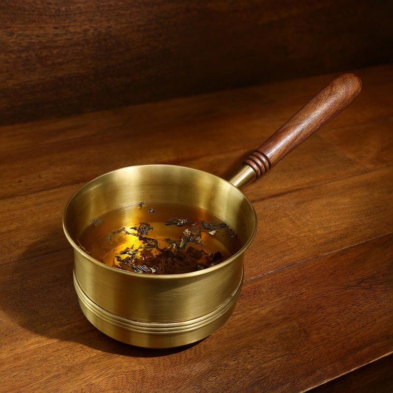 https://interiorsndecor.com/wp-content/uploads/2022/03/Arra-Brass-Tea-Pan-With-Wooden-Handle-2.jpg